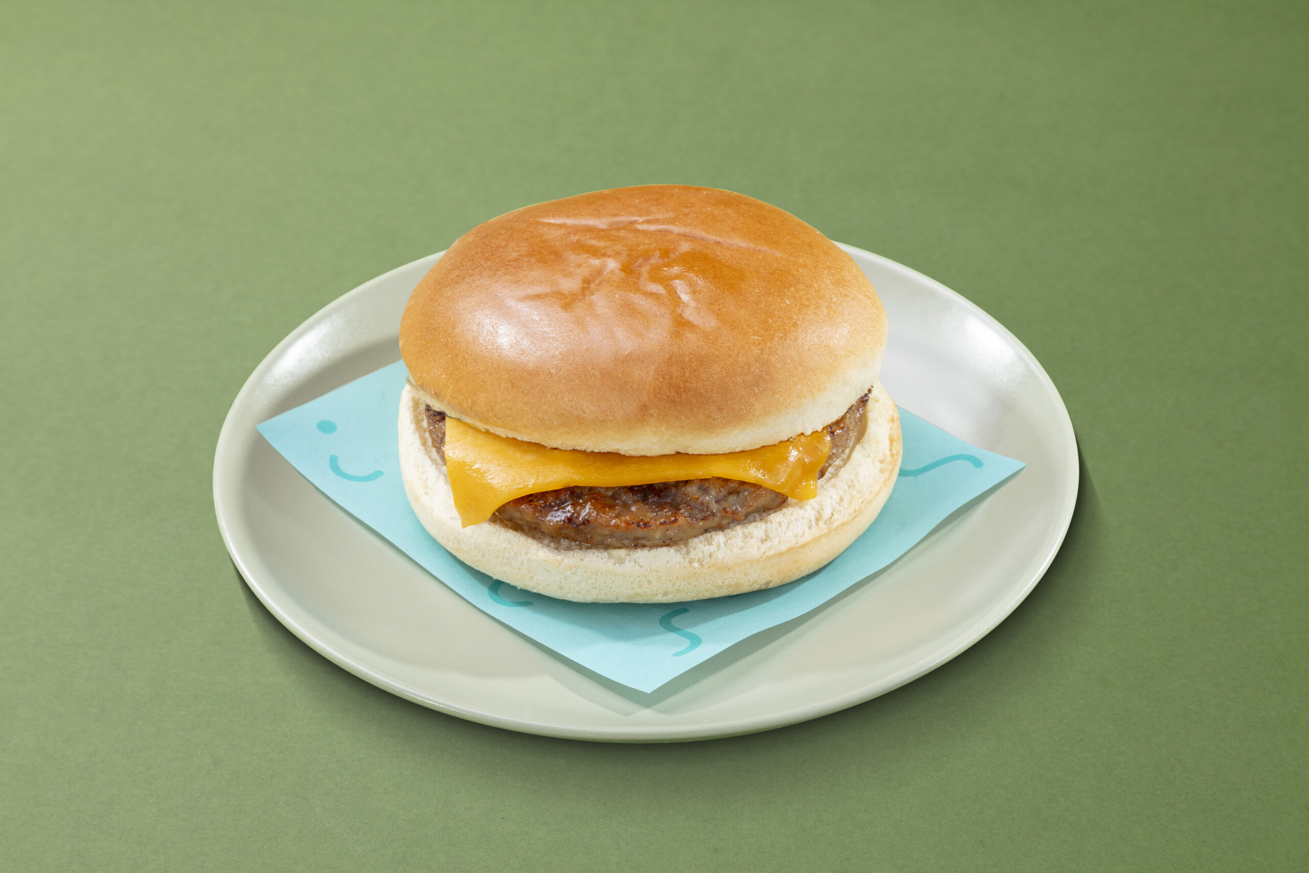 a single cheeseburger in a brioche bun